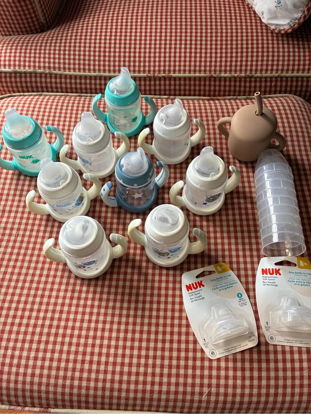 Lot of 9 Nuk Sippy Cups, 2 Extra Nipples, 9 Lids, and 1 Mushie Silicone Cup